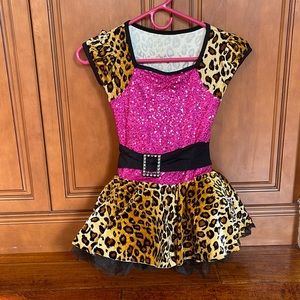 Leopard and dark pink dance costume with black tutu underneath. Blinged belt.